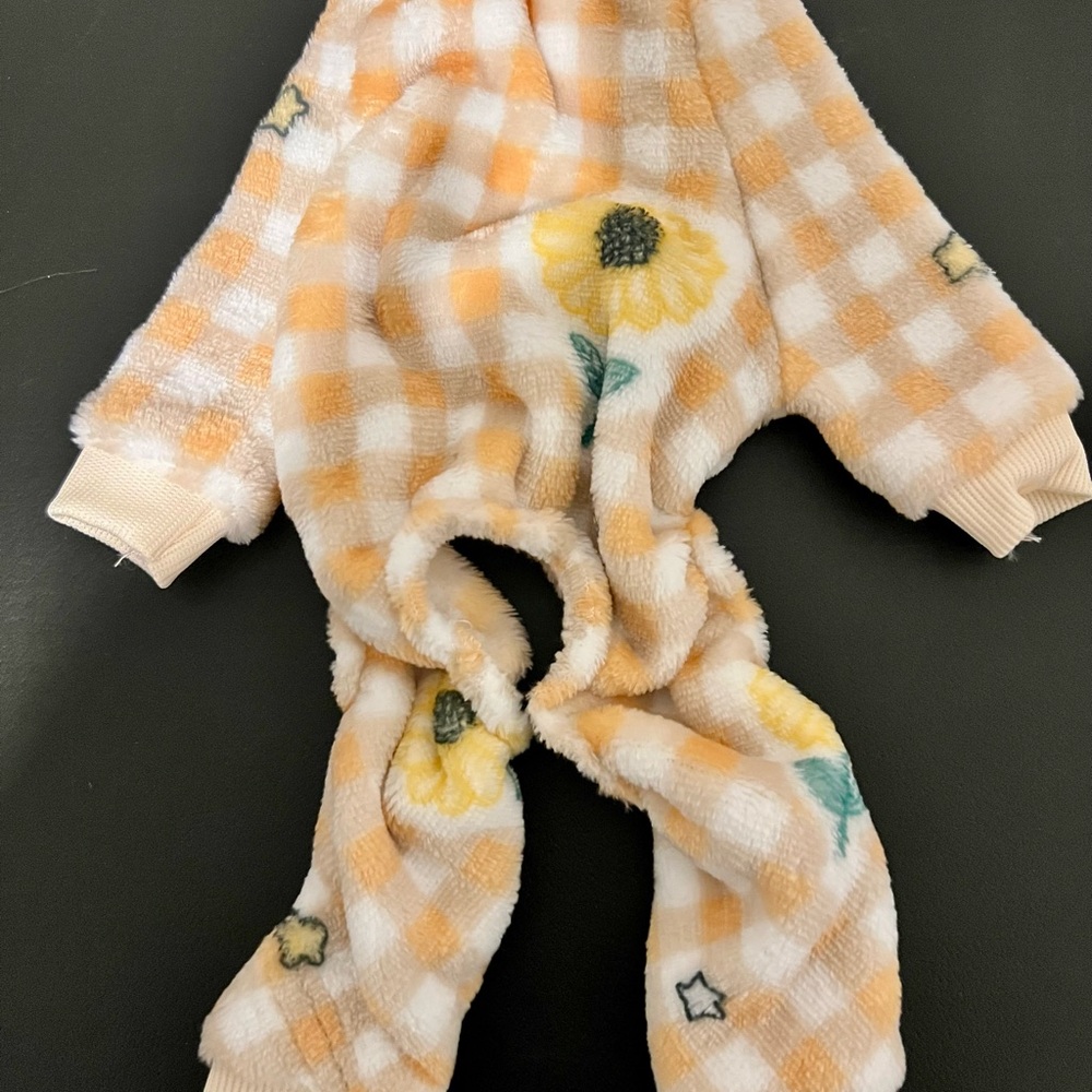 Dog pajamas with a cozy checkered and sunflower design. NWOT